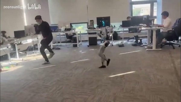 Robot kicks human cover